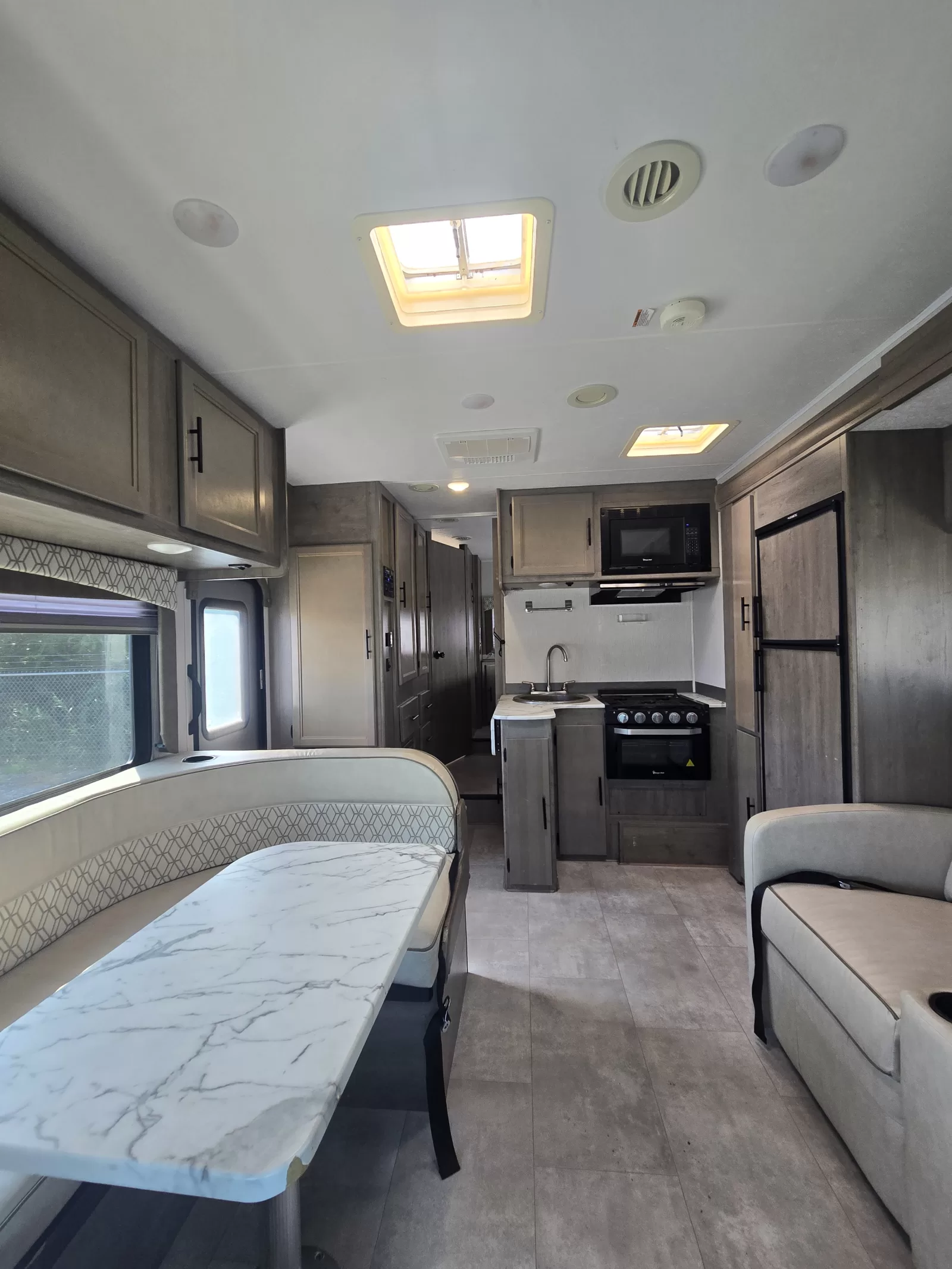 2021 Coachmen Freelander 26DS Class C living area at Bell Camper Sales in Bartlesville, Oklahoma