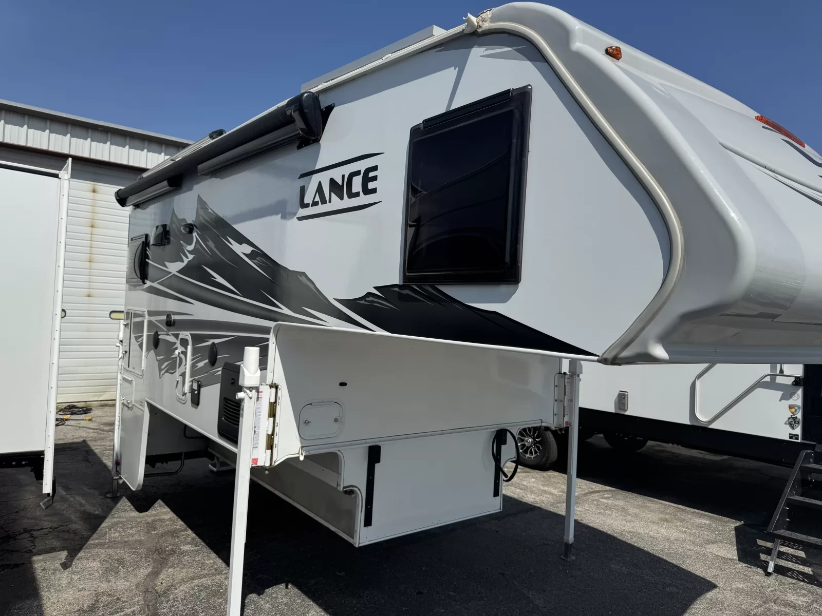 2025 Lance 975 truck camper front exterior available at Bell Camper Sales in Bartlesville, Oklahoma