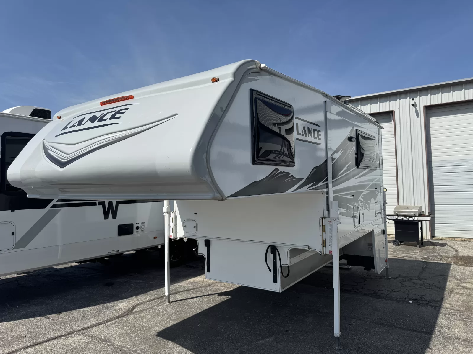 2025 Lance 975 truck camper rear exterior available at Bell Camper Sales in Bartlesville, Oklahoma