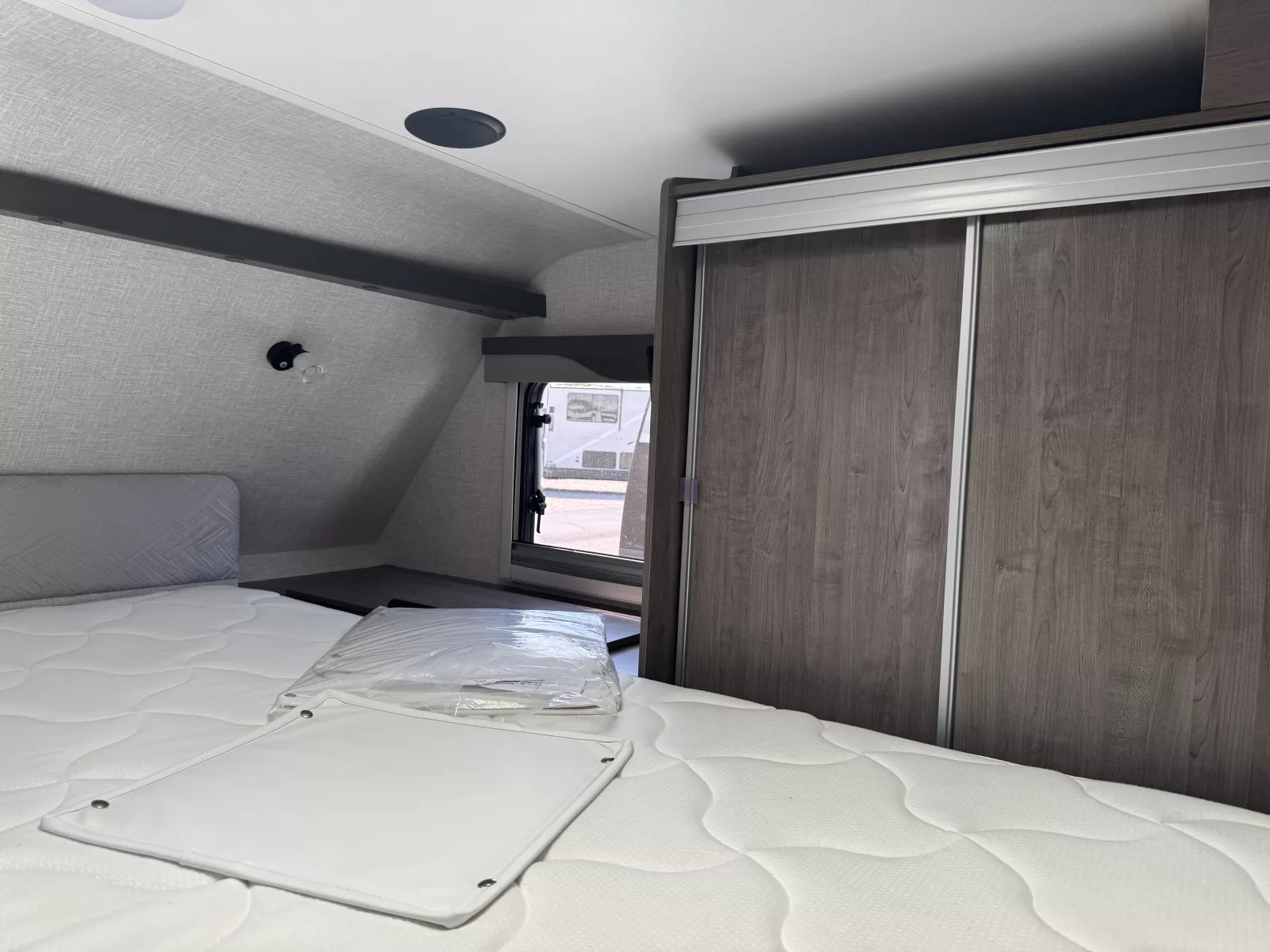 2025 Lance 975 truck camper living area available at Bell Camper Sales in Bartlesville, Oklahoma