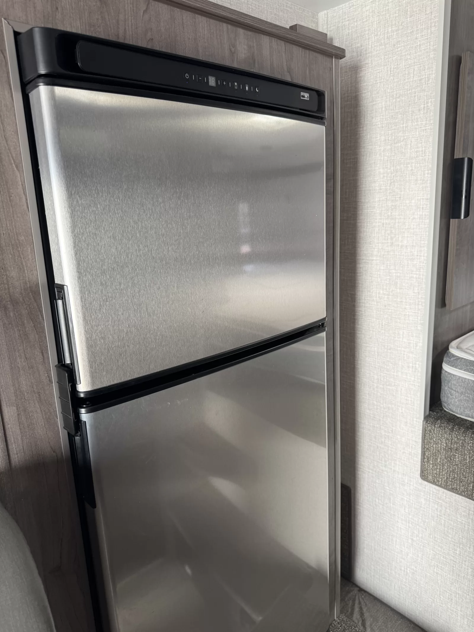 2025 Lance 975 truck camper bedroom available at Bell Camper Sales in Bartlesville, Oklahoma