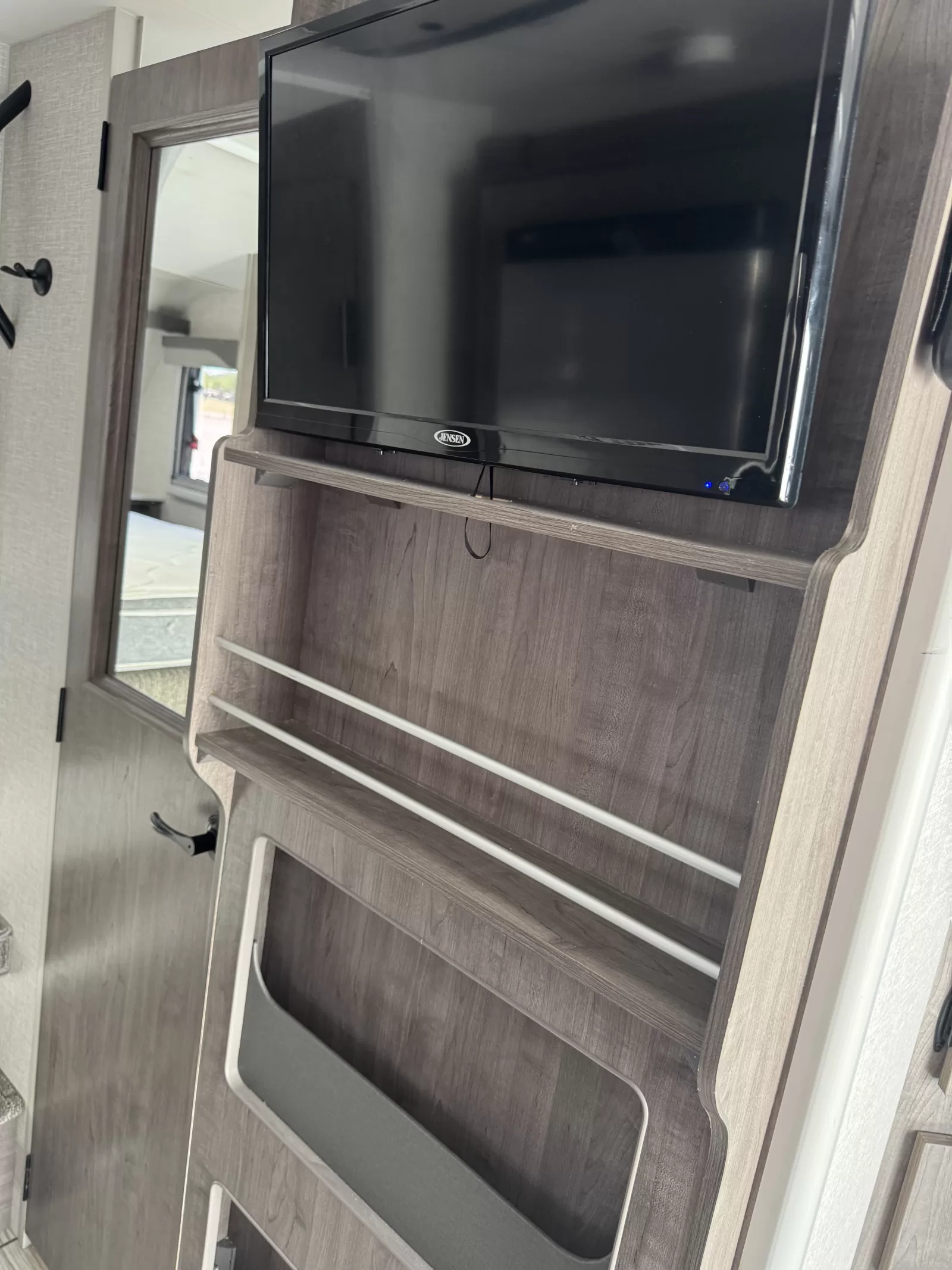 2025 Lance 975 truck camper storage compartment at Bell Camper Sales in Bartlesville, Oklahoma