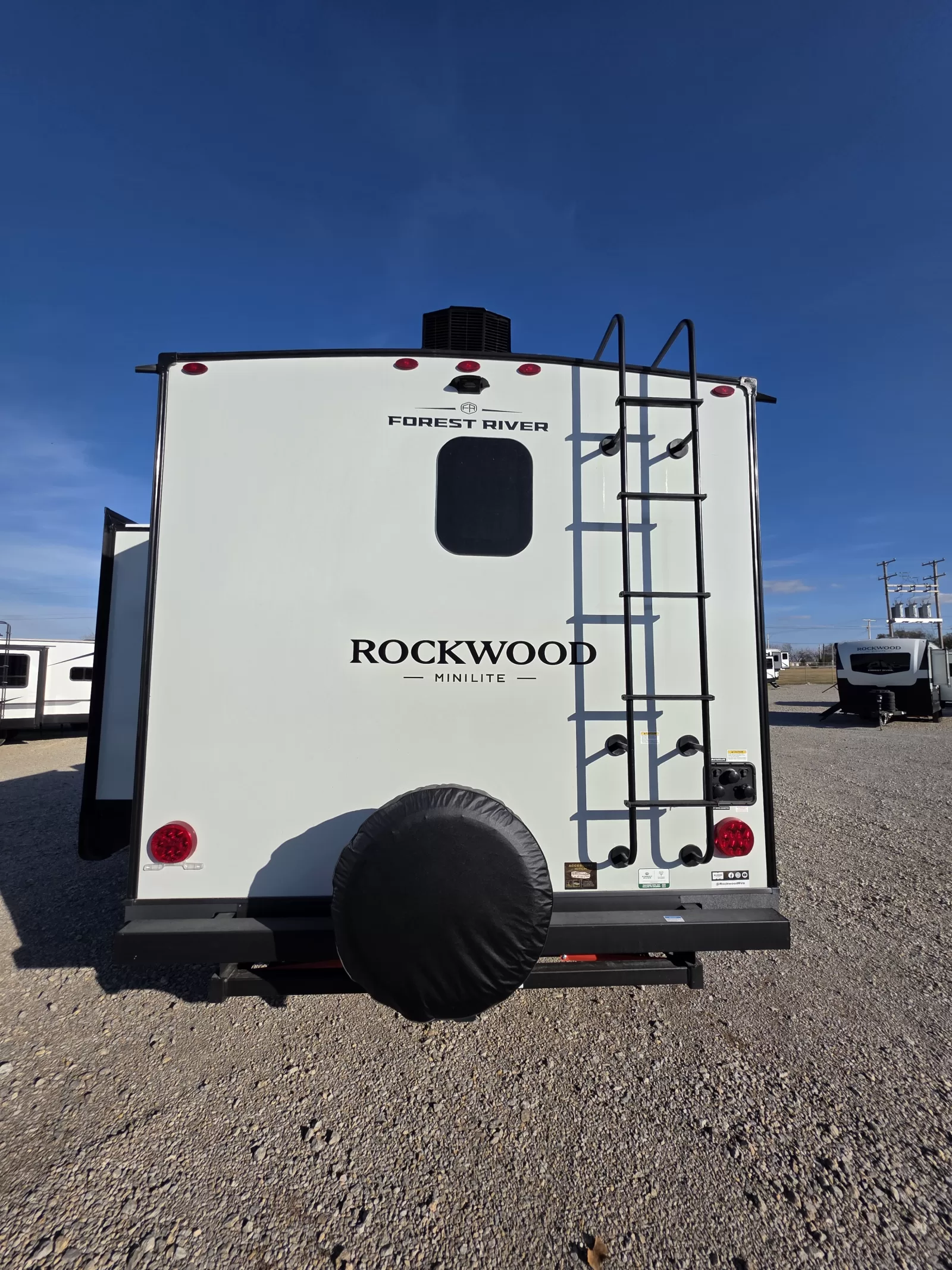 2027 Rockwood Mini Lite 2523MBR travel trailer kitchen and dining area available at Bell Camper Sales in Bartlesville, Oklahoma