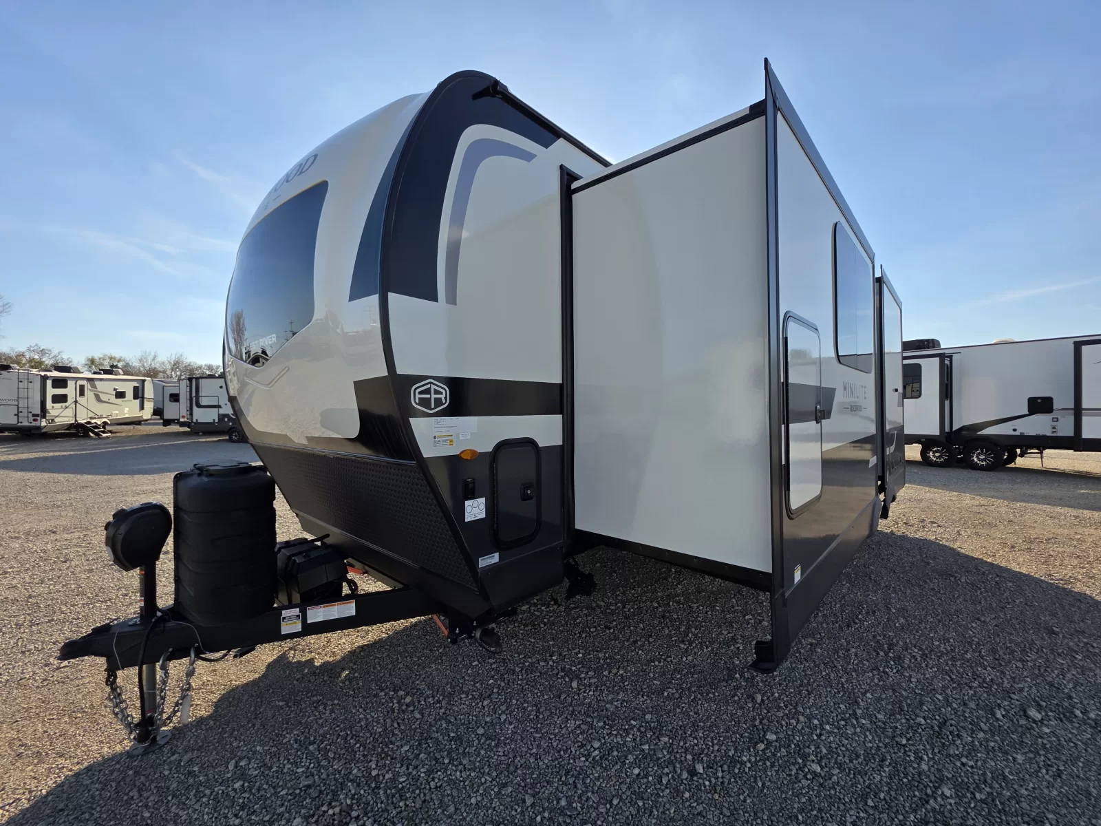 2027 Rockwood Mini Lite 2523MBR travel trailer kitchen and dining area at Bell Camper Sales in Bartlesville, Oklahoma