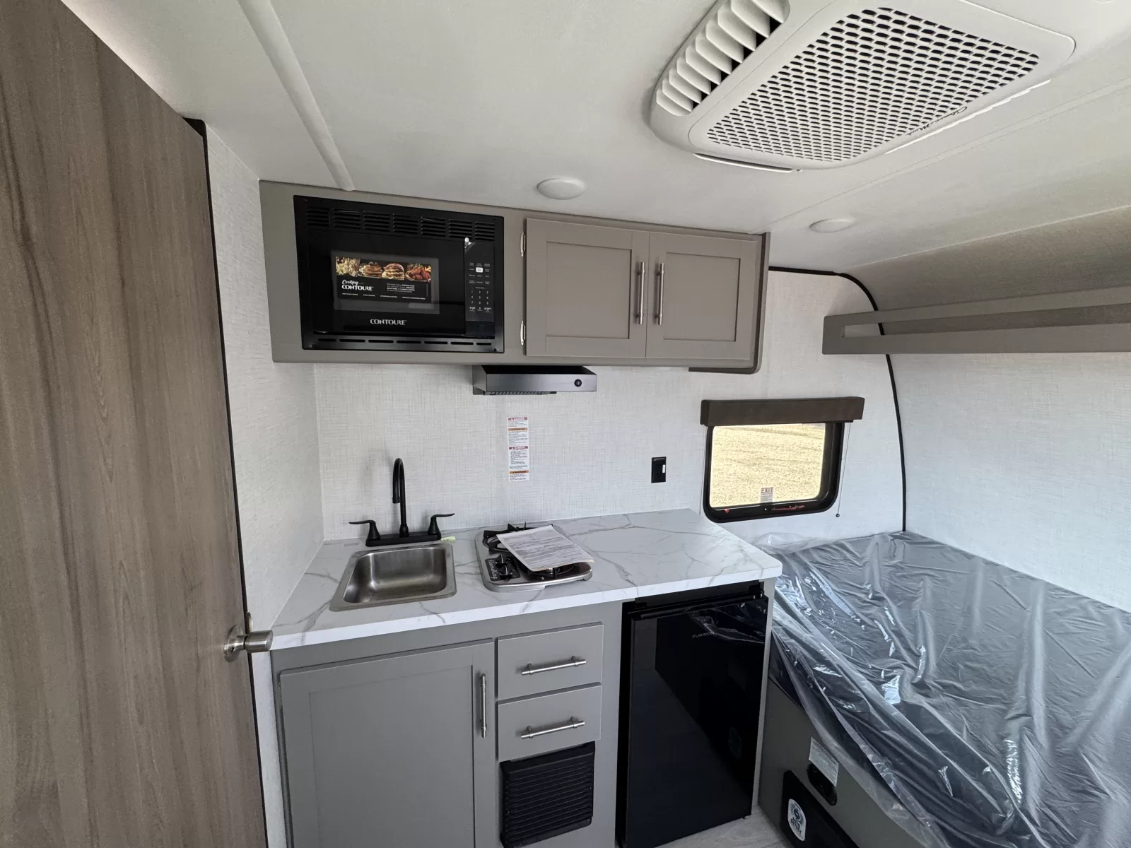 2027 Keystone Hideout 120BT travel trailer sleeping quarters available at Bell Camper Sales in Bartlesville, Oklahoma