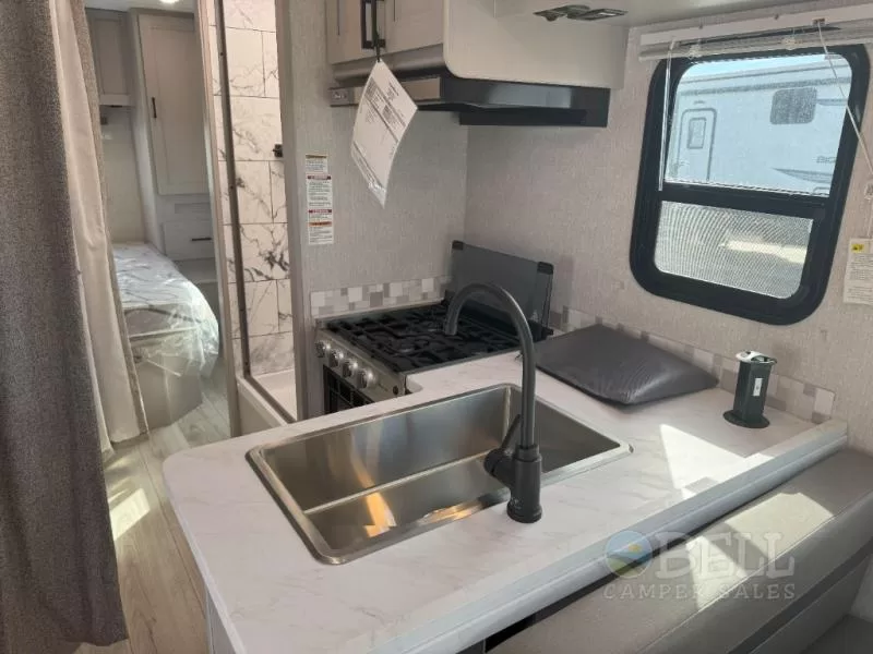 2024 Coachmen Freelander 27QB Class C motorhome cockpit and driver area at Bell Camper Sales in Bartlesville, Oklahoma